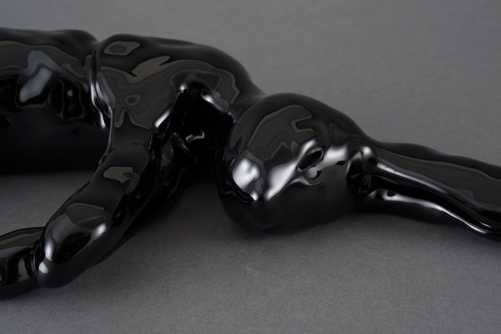 detail of Black rabbit sculpture by artist Suzanne Walters 