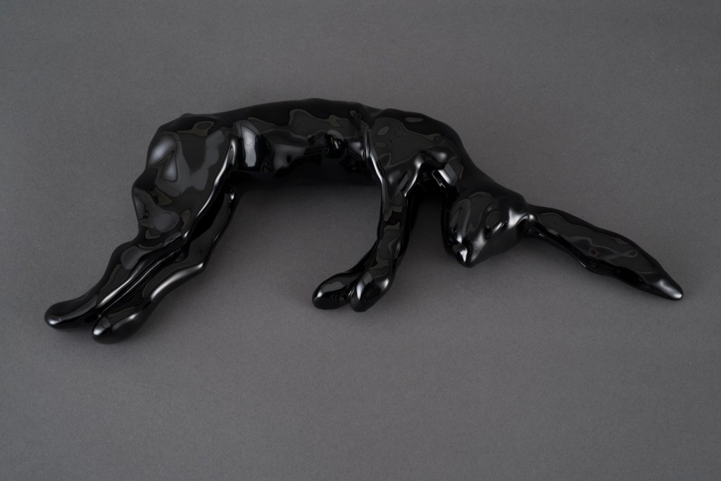 Black rabbit sculpture by artist Suzanne Walters 