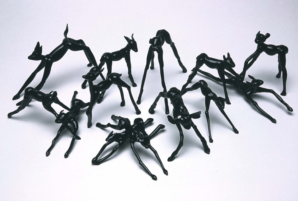 black glass sculpture Thirteen Figures Behaving Badly glass by artist Suzanne Walters