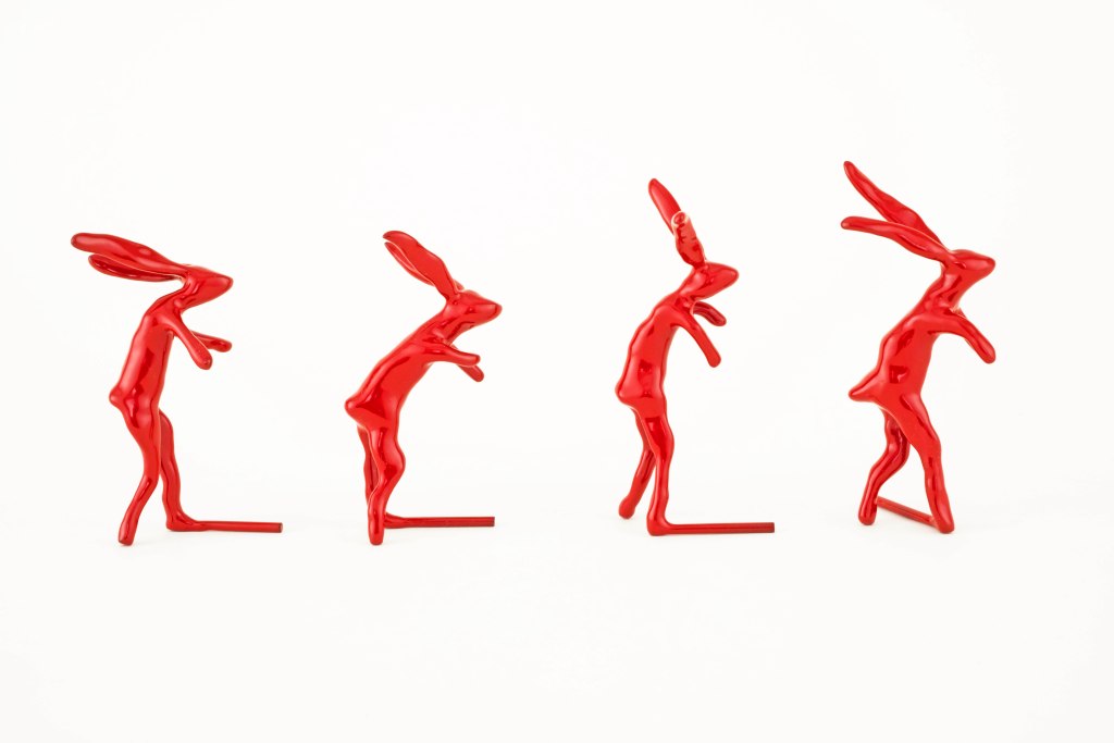 Marching Rabbits sculpture by artist Suzanne Walters, side view